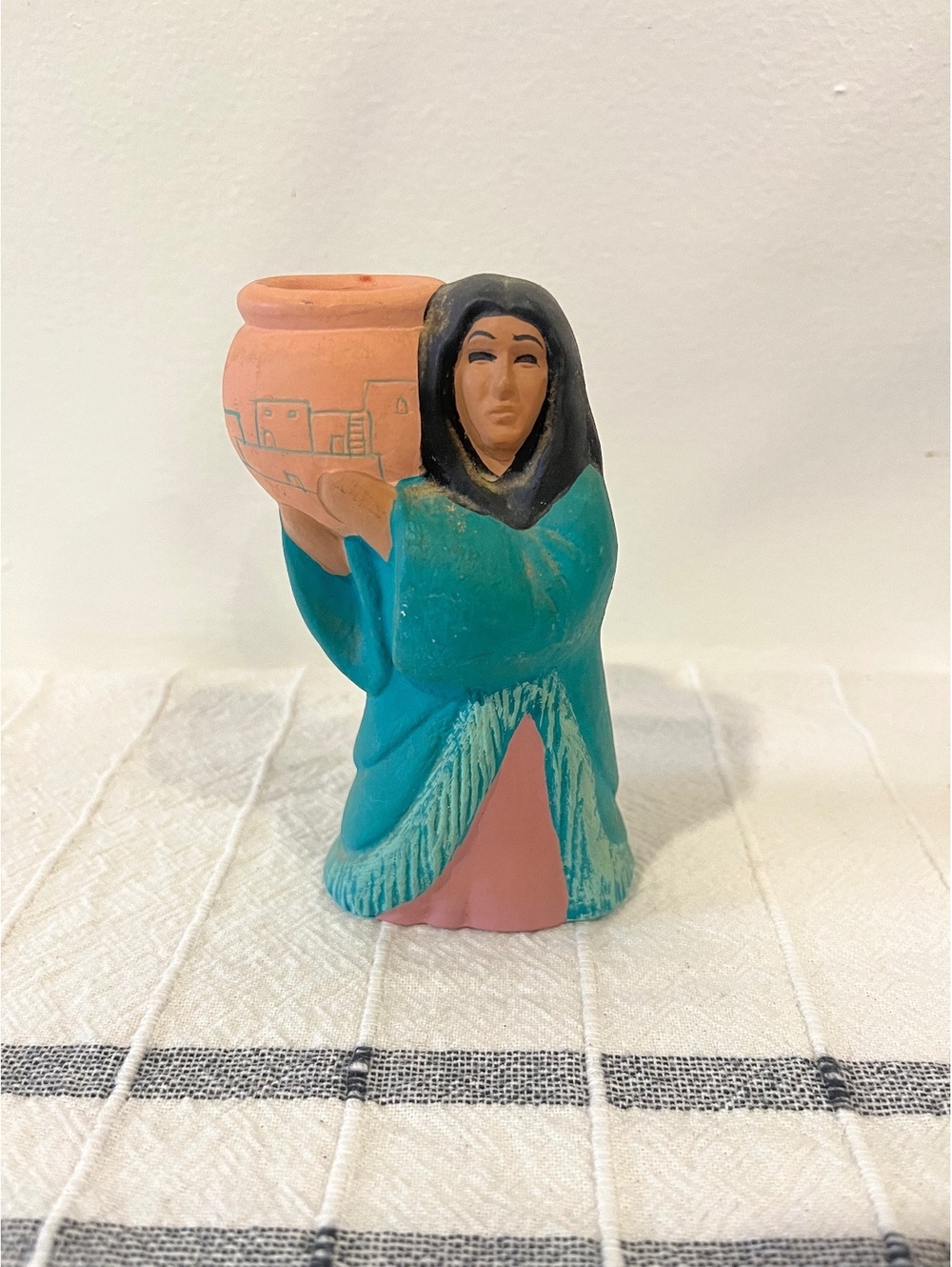 Woman with pot figurine